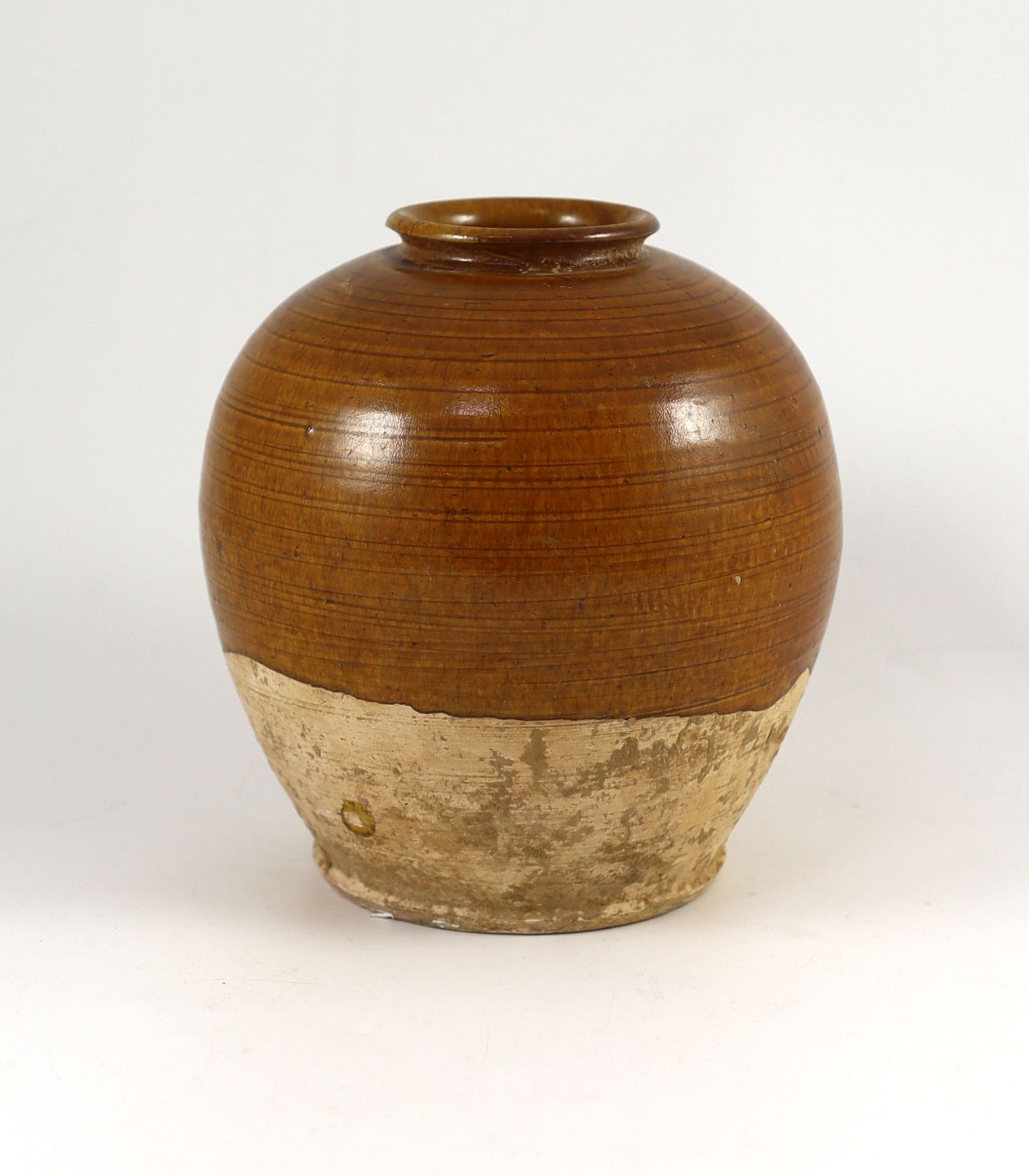 A Chinese straw glazed ovoid jar, Tang dynasty 19.5cm high